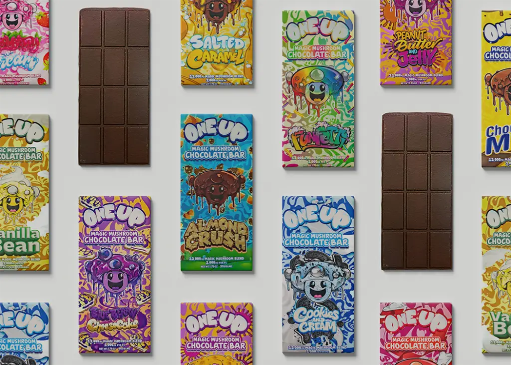 flat lay photo of a assorted flavors of One Up Mushroom Chocolate Bars.