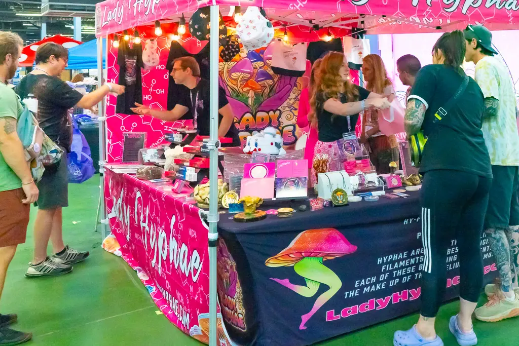 Mushfest Vendor booth of female owned business decorated all in hot pink.